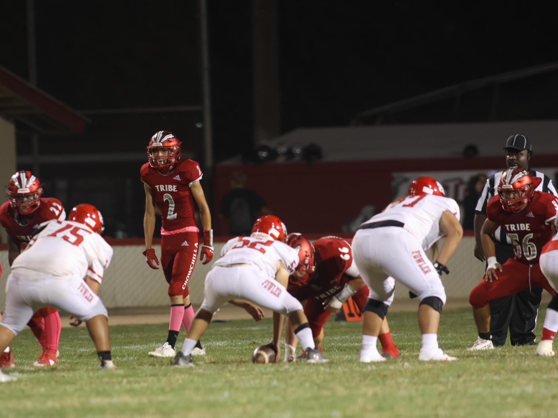 varsity boys playing football against Fowler