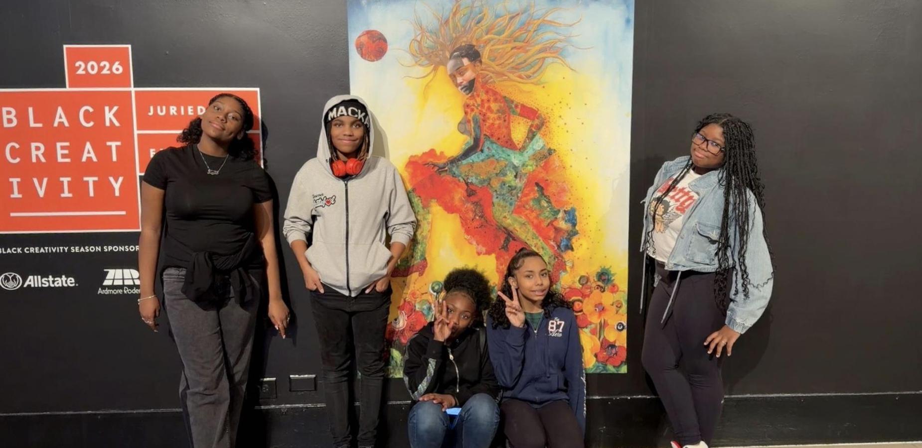 Middle school students visiting an art exhibit.