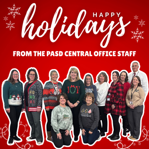 Photo of central office staff members with a red and white snowflake theme
