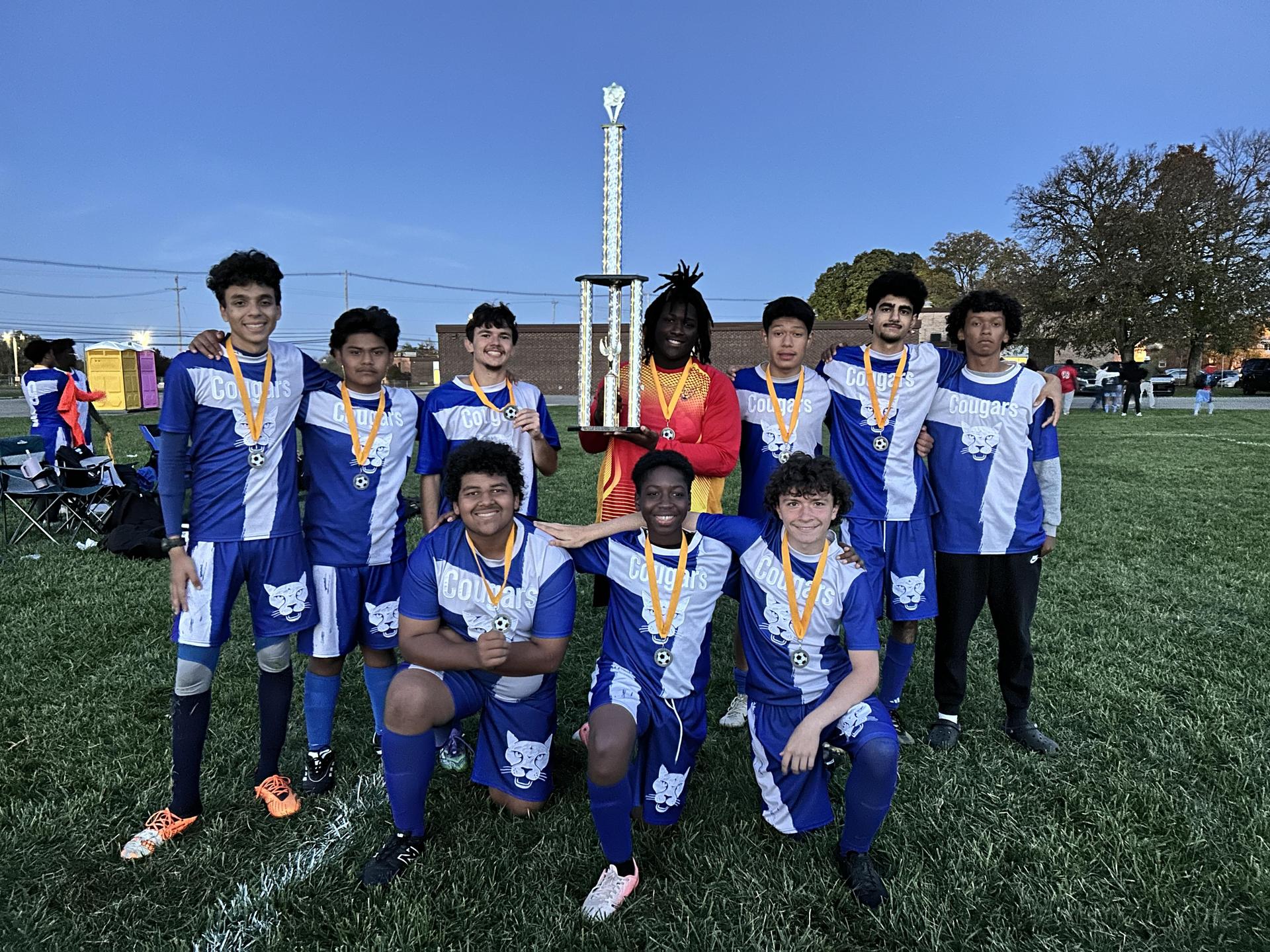 Soccer Team Holding Trophy