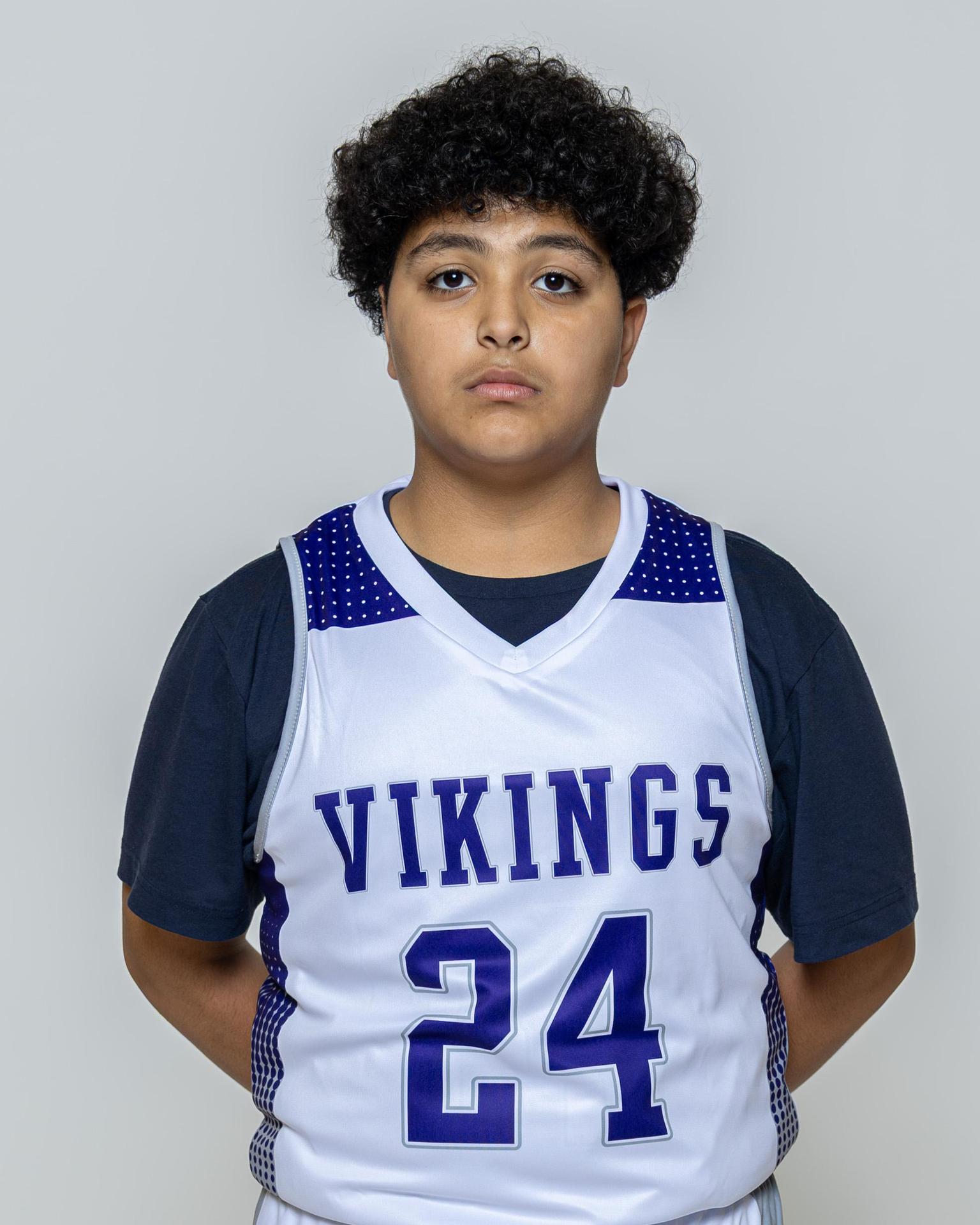 Male player number 24 posing with serious stature for a picture