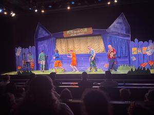 students watch a puppet show.