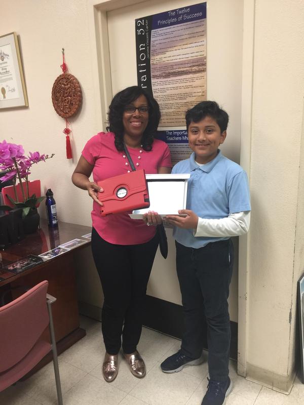 Ms. Murray Presents iPad to Attendance Lottery Winner 2018 Featured Photo