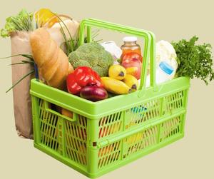 green basket of fruits and vegetables