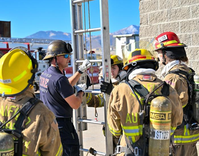 fire science teacer instucting about ladder safety