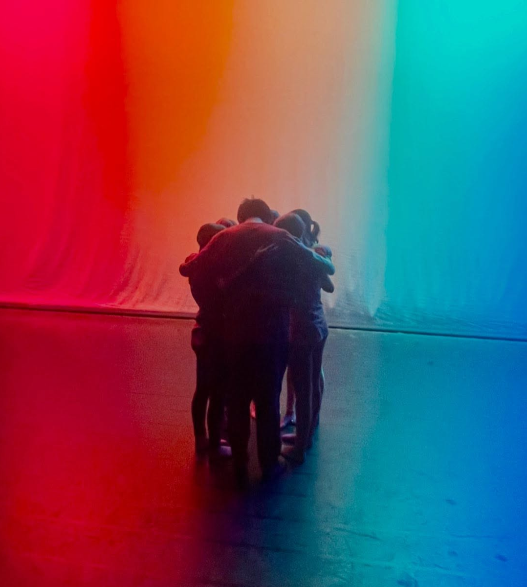 Dance students huddling
