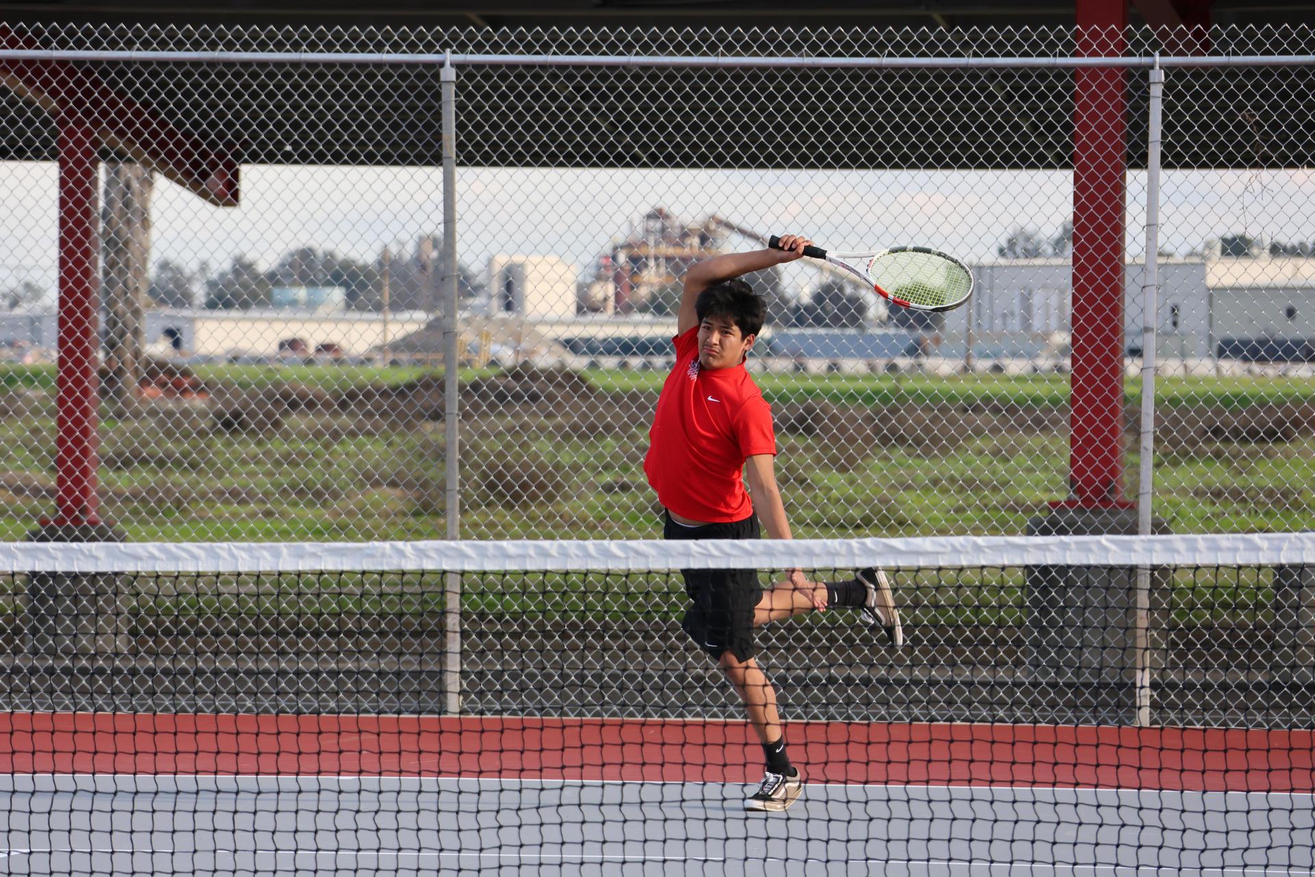 CUHS Boys playing tennis against coalinga