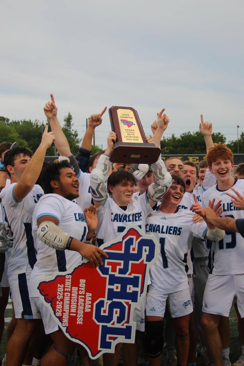boys lacrosse team celebrating