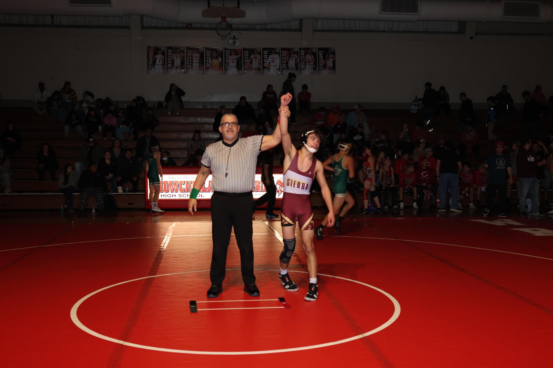 Wrestling winners with hands up 59