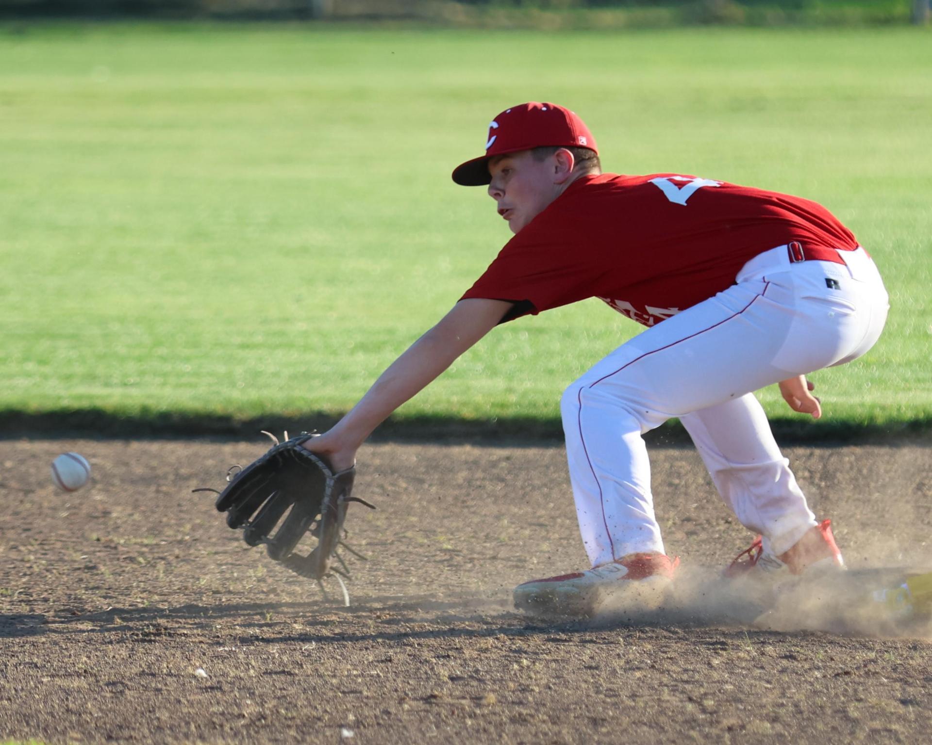 junior varsity baseball players in action