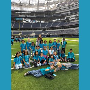 kids on the field of sofi stadium