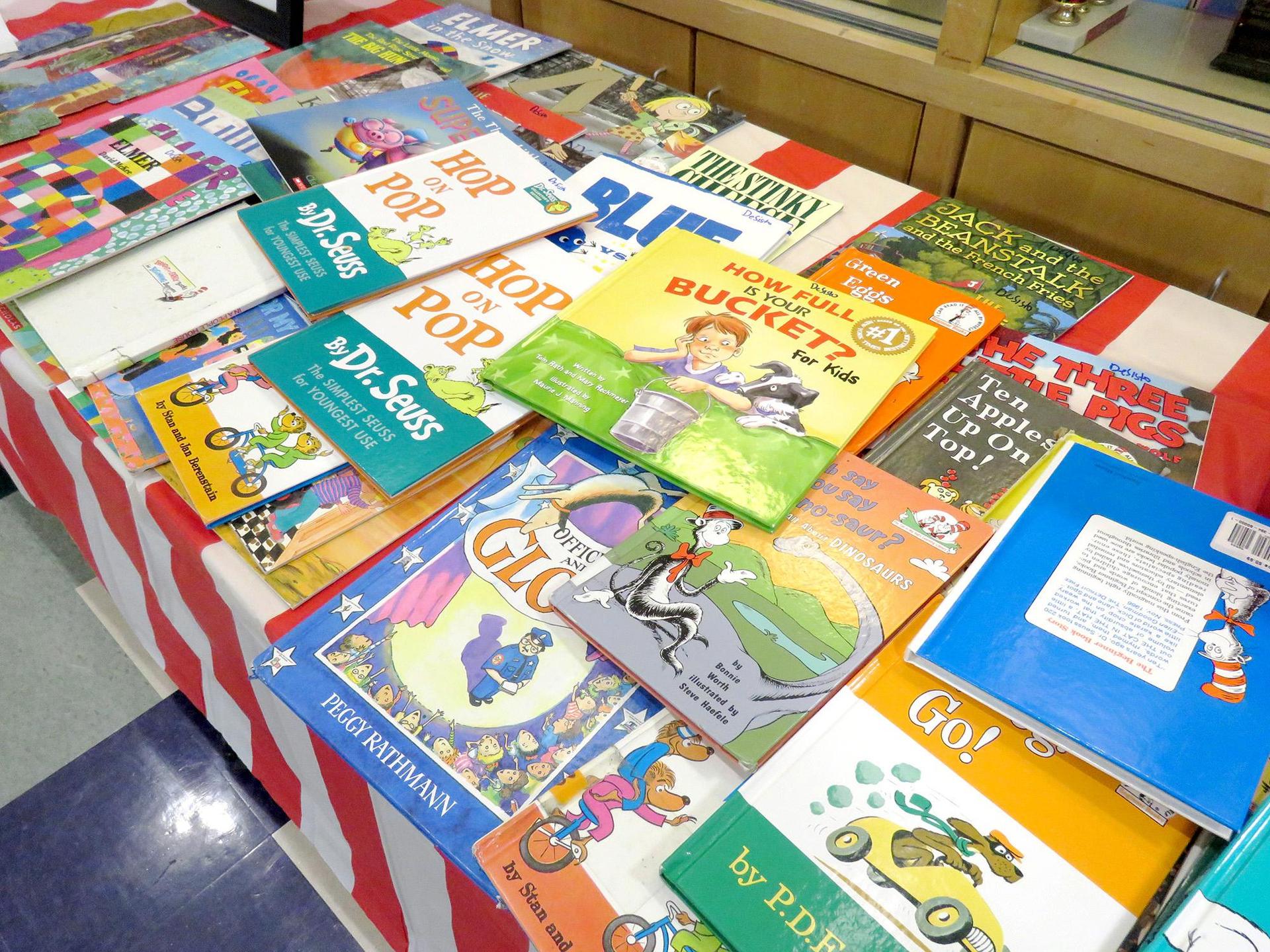 A table filled covered with children's books