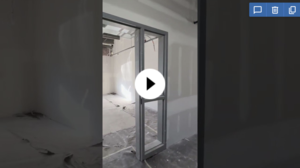 YouTube thumbnail showing the interior of an office building under construction.
