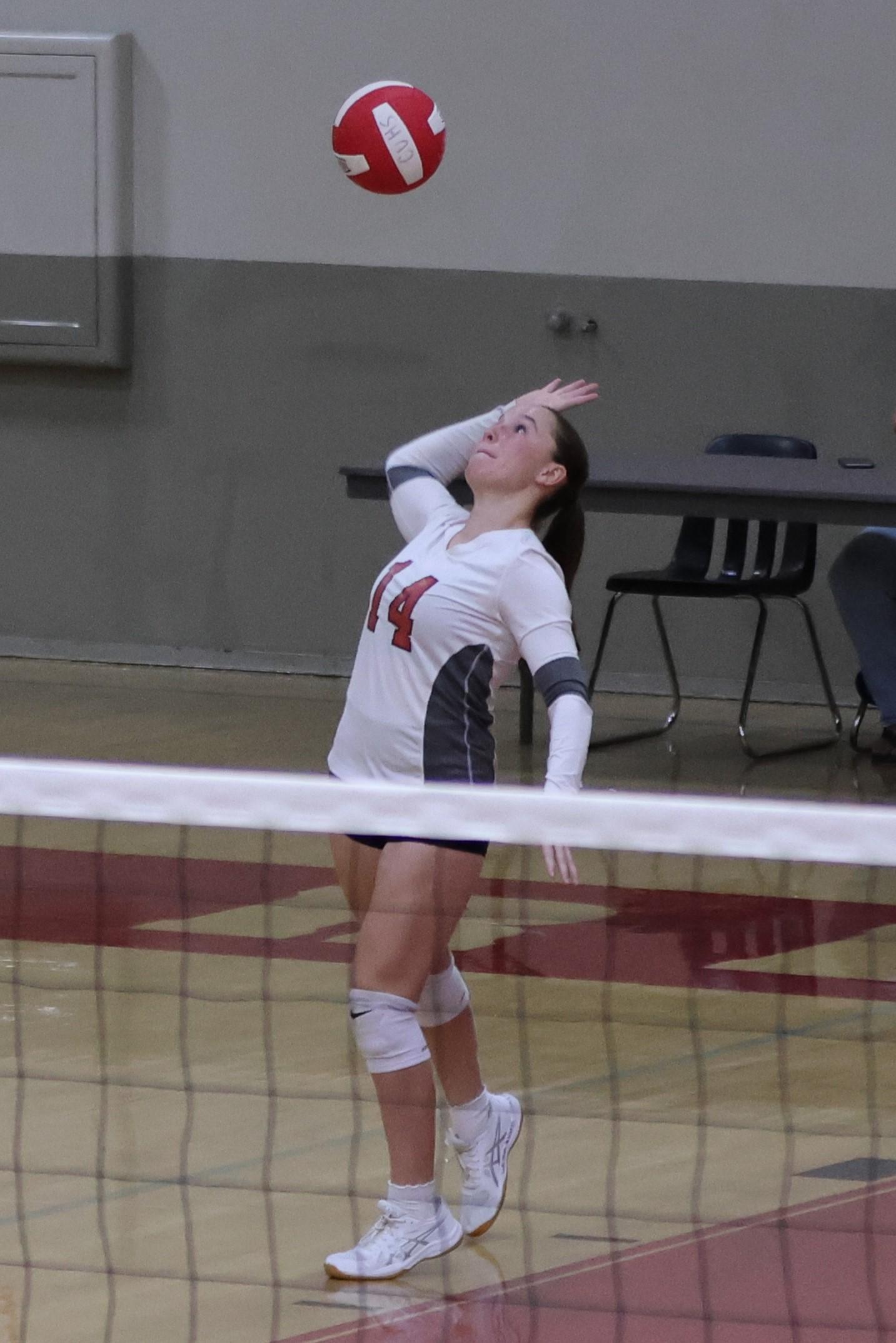 junior varsity girls playing volleyball 82