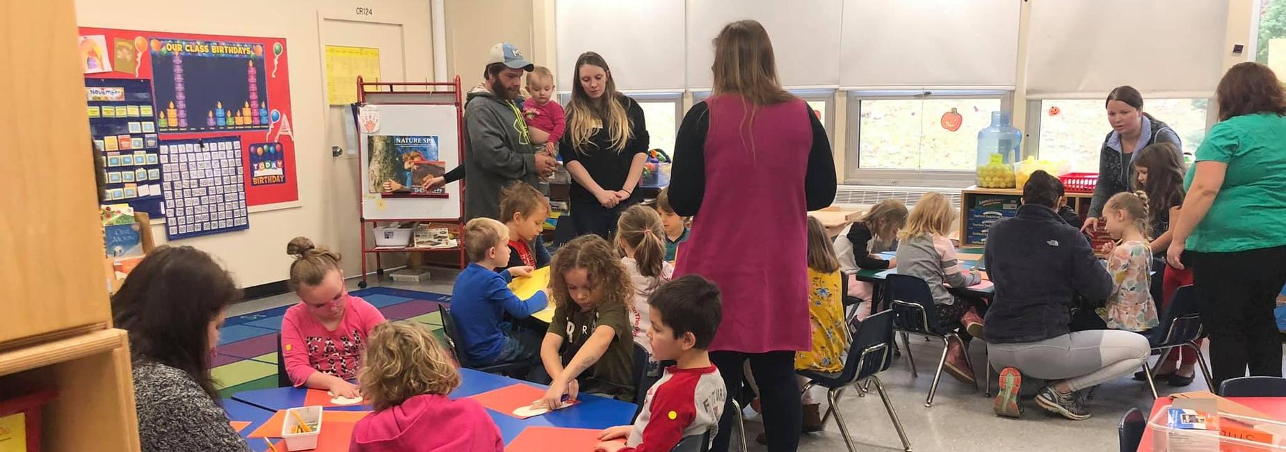 families and students gathering in a classroom