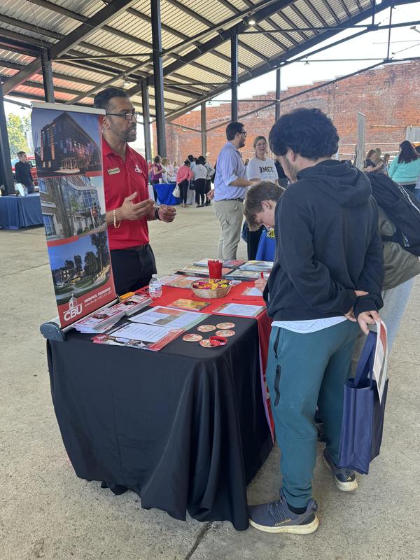 PHS students at the career fair, meeting with different people at tables