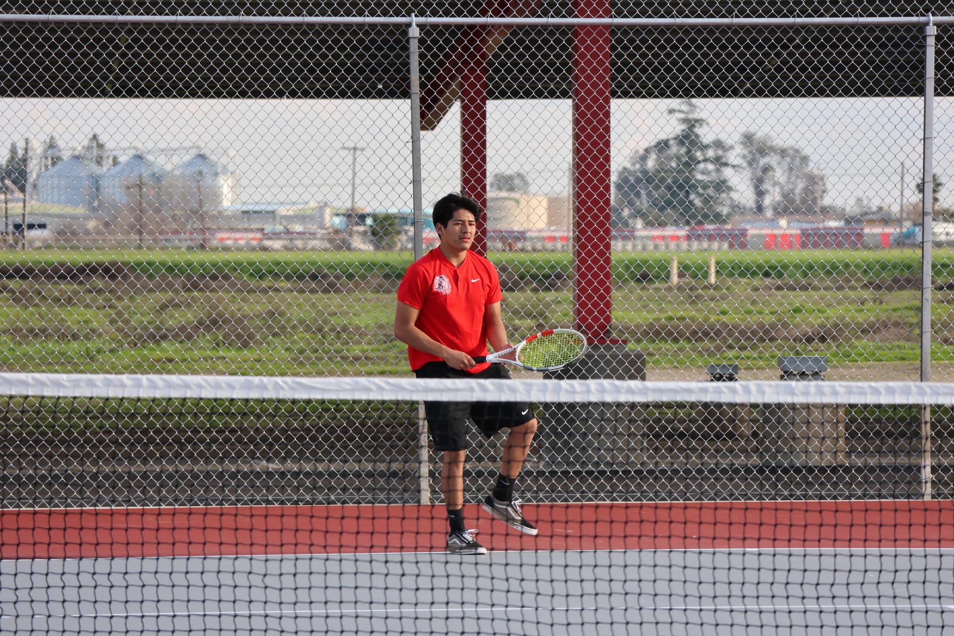 CUHS Boys playing tennis against coalinga