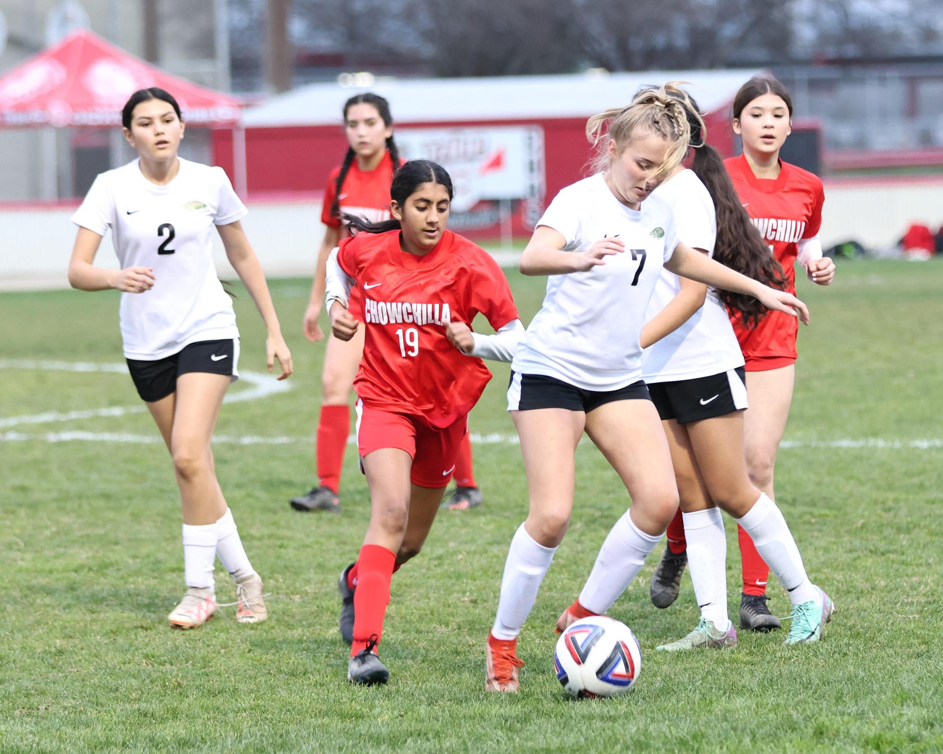 Junior varsity girls playing soccer against liberty