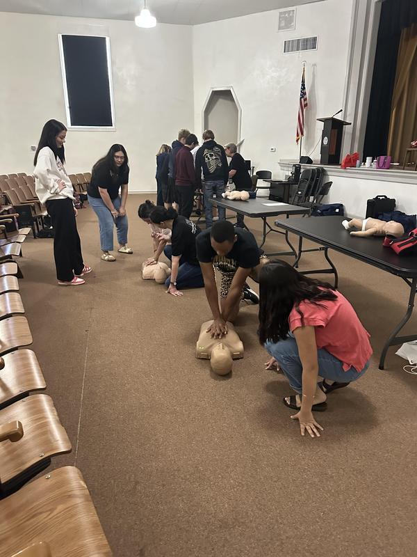 Senior students learning CPR.