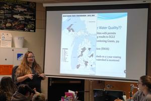 Dana Strouse with the Michigan Dept. of Great Lakes and Energy shows students water sheds in Michigan.