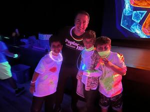 Students and staff at a glow in the dark fun run.