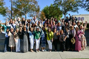 Retirees cheer and celebrate during the Retirement Recognition event.