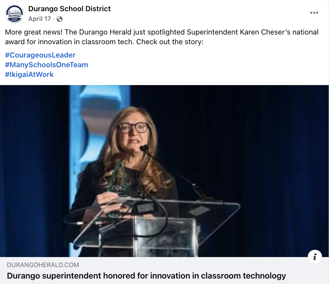 Facebook post showing an adult with long, blonde hair presenting behind a podium