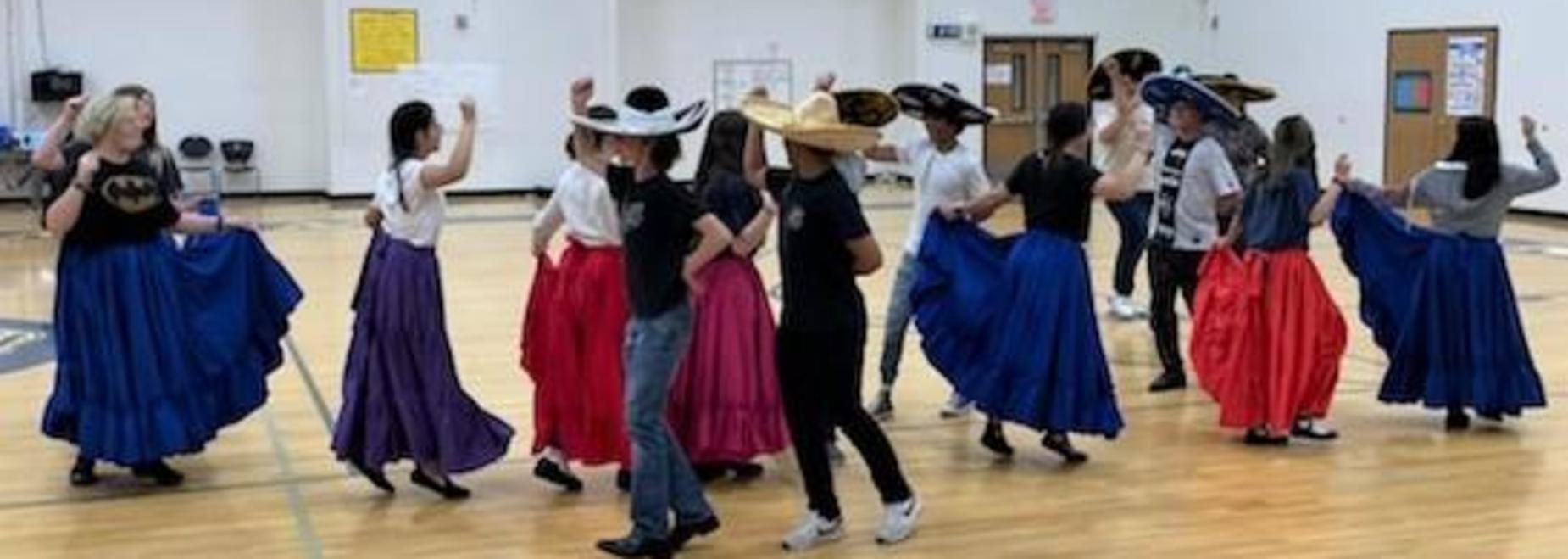 Hispanic dance students practicing for their performances.