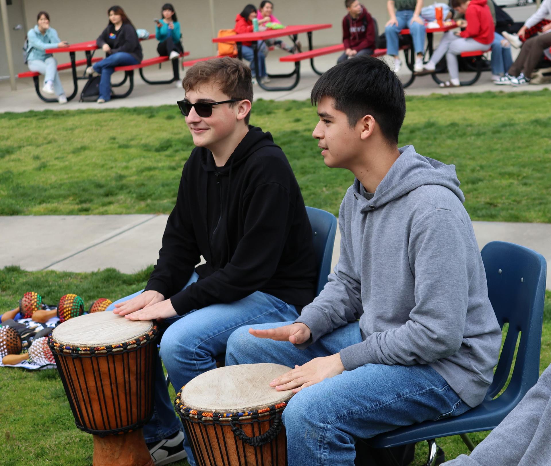 students and staff participating with the African Drum Interactive