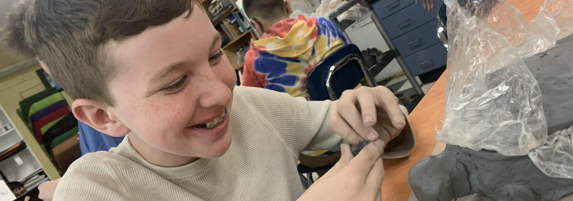 working with clay in art class