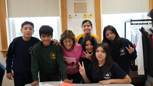 Mrs. Strok with students working on Championship Belts based on short story, Amigo Brothers by Piri Thomas
