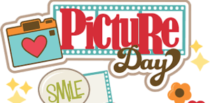 picture day sign with camera, red heart and a sign that says smile