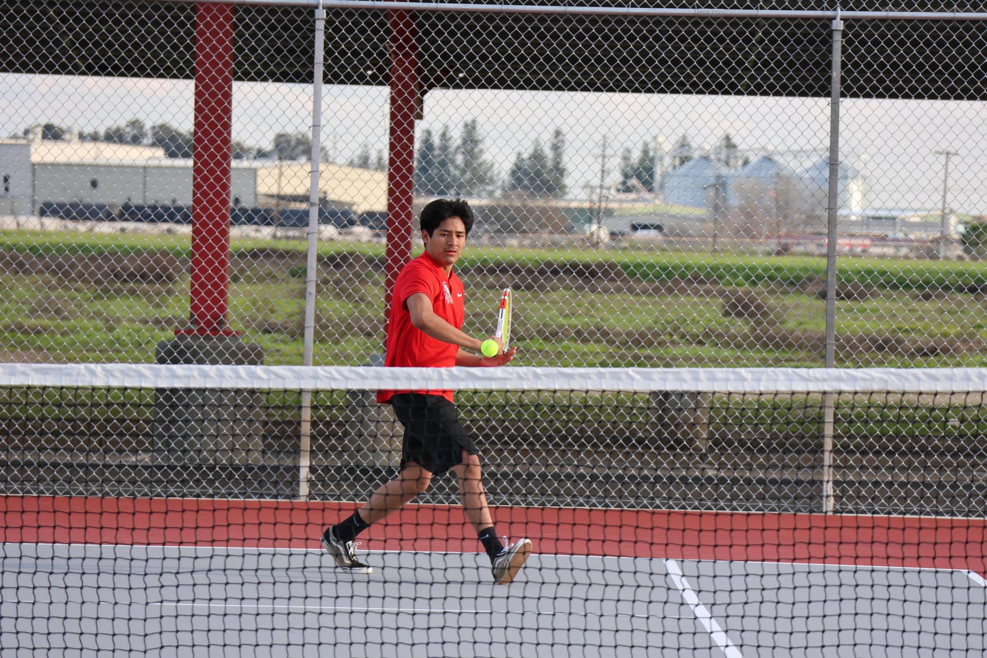 CUHS Boys playing tennis against coalinga