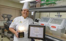 Woman holding award