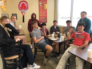 Tennis Team having pizza!