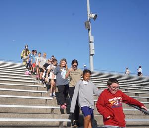 Students go up and down the stairs at Bob White Stadium for the Sept. 11 stair climb challenge.