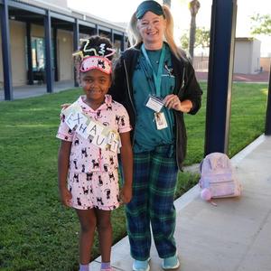 student and staff member depicting exhausted and slumberous