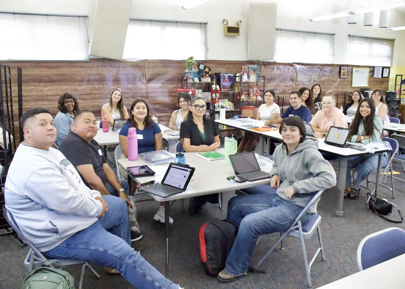 New teachers and staff sit at a table