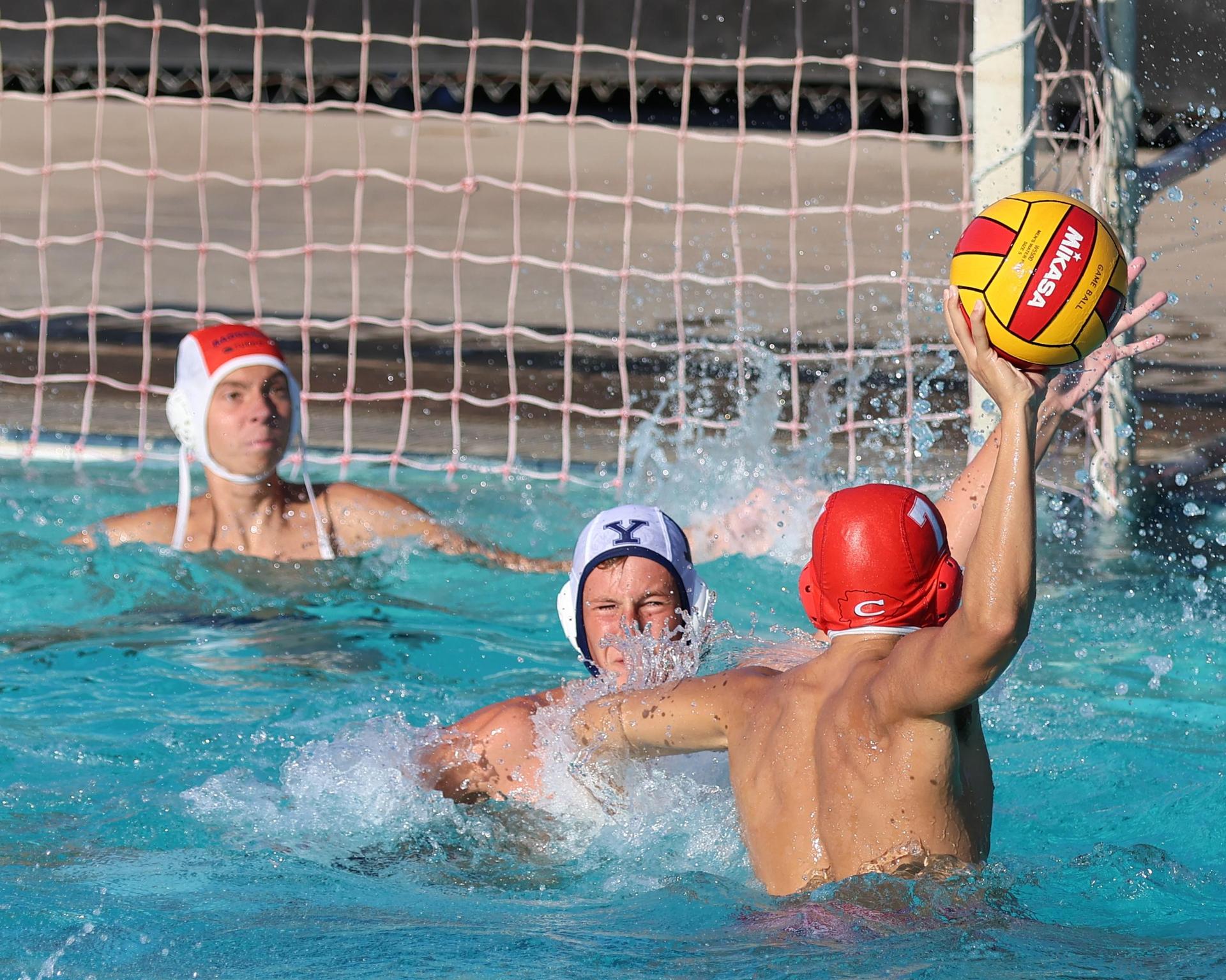 Boys playing water polo against Yosemite