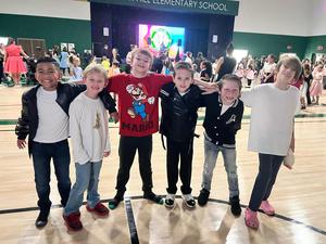 Children wearing 1950's style clothes.