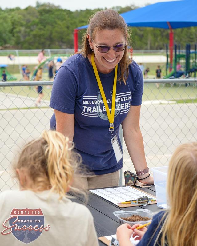 - Bill Brown PTA member Kyle Burns assisting in a Garden Lab lesson.