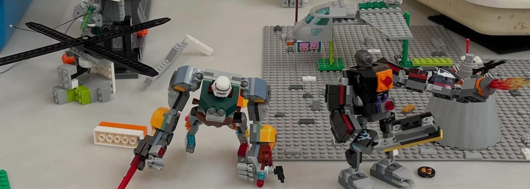 Colorful Lego figures and scenes arranged on a table, showcasing creative builds.