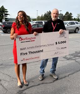Dr. Anzinger recieving giant check from Burlington