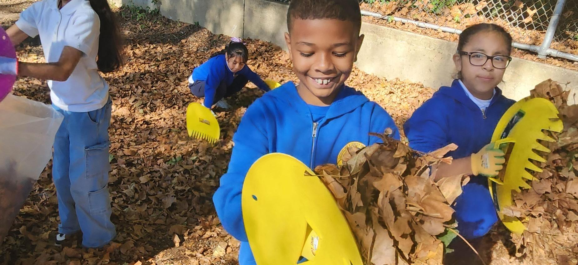 students cleaning litter at a park
