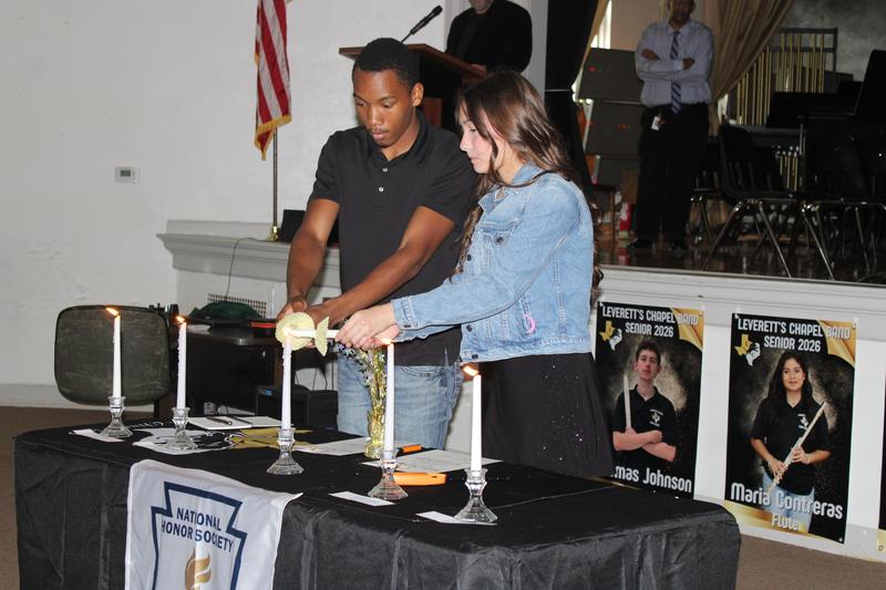 Layla and DeWaylon performing the ceremony to be inducted into the NHS.