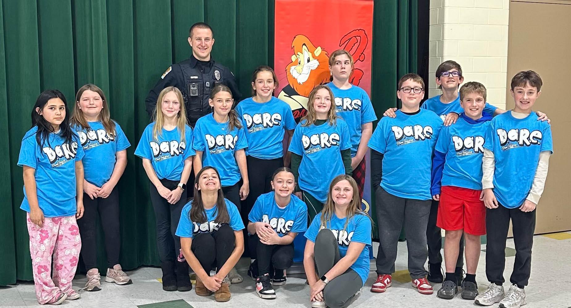 5th-graders at Harrison Park celebrate completion of the DARE program with Officer Meyers