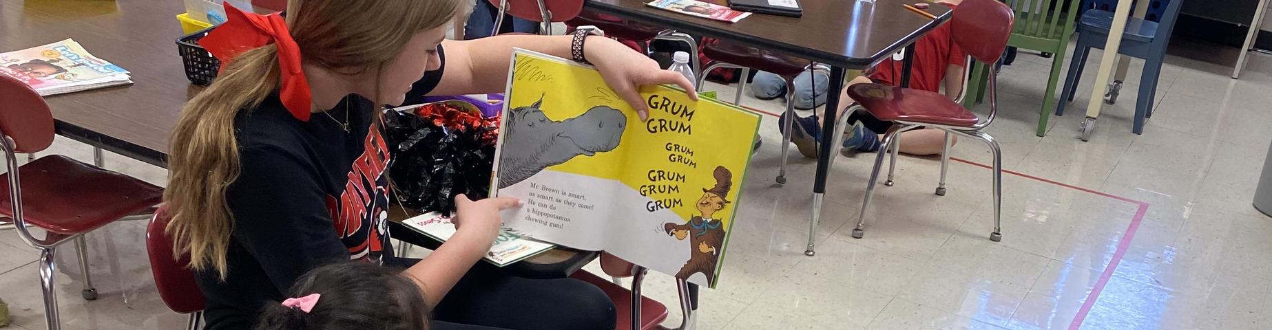 MES students loved having MHS students in their class reading books.