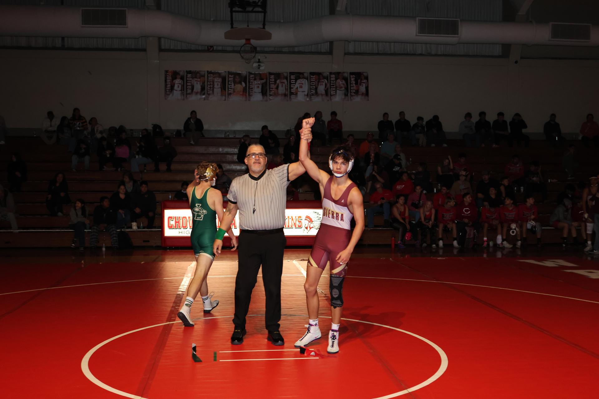 Wrestling winners with hands up 61