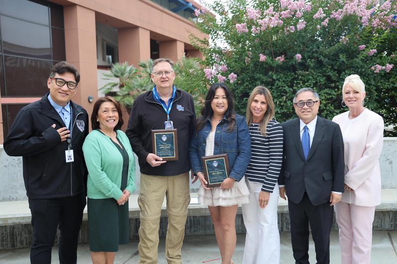 Winners pictured with the Board of Education