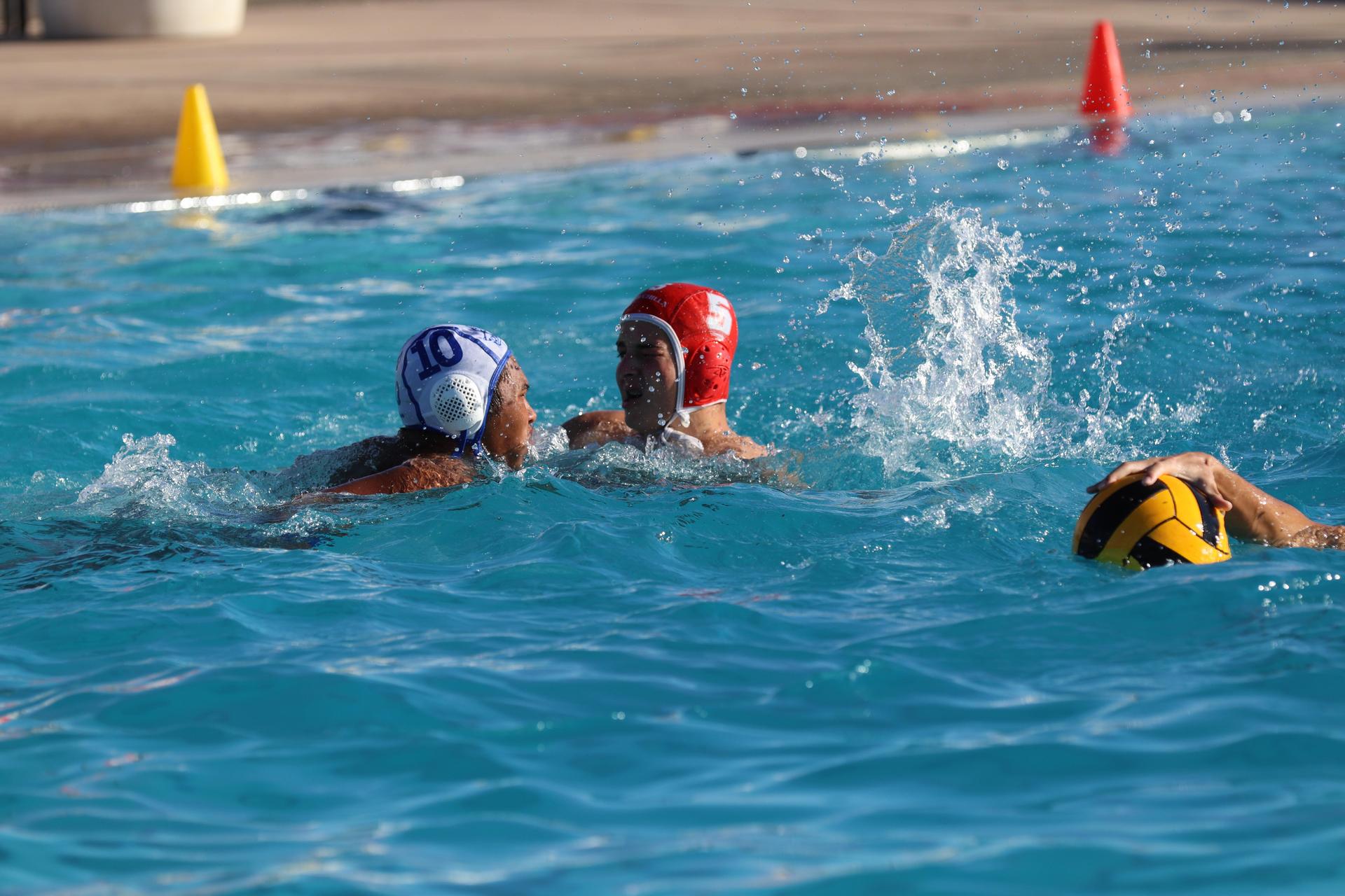 boys playing water polo against Madera